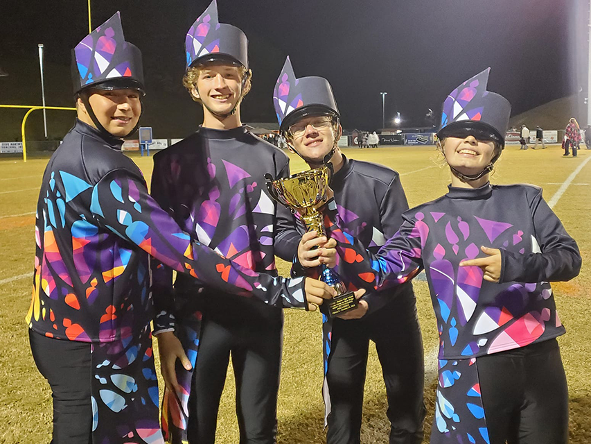 Highschool band uniforms, colorful, band wins trophy