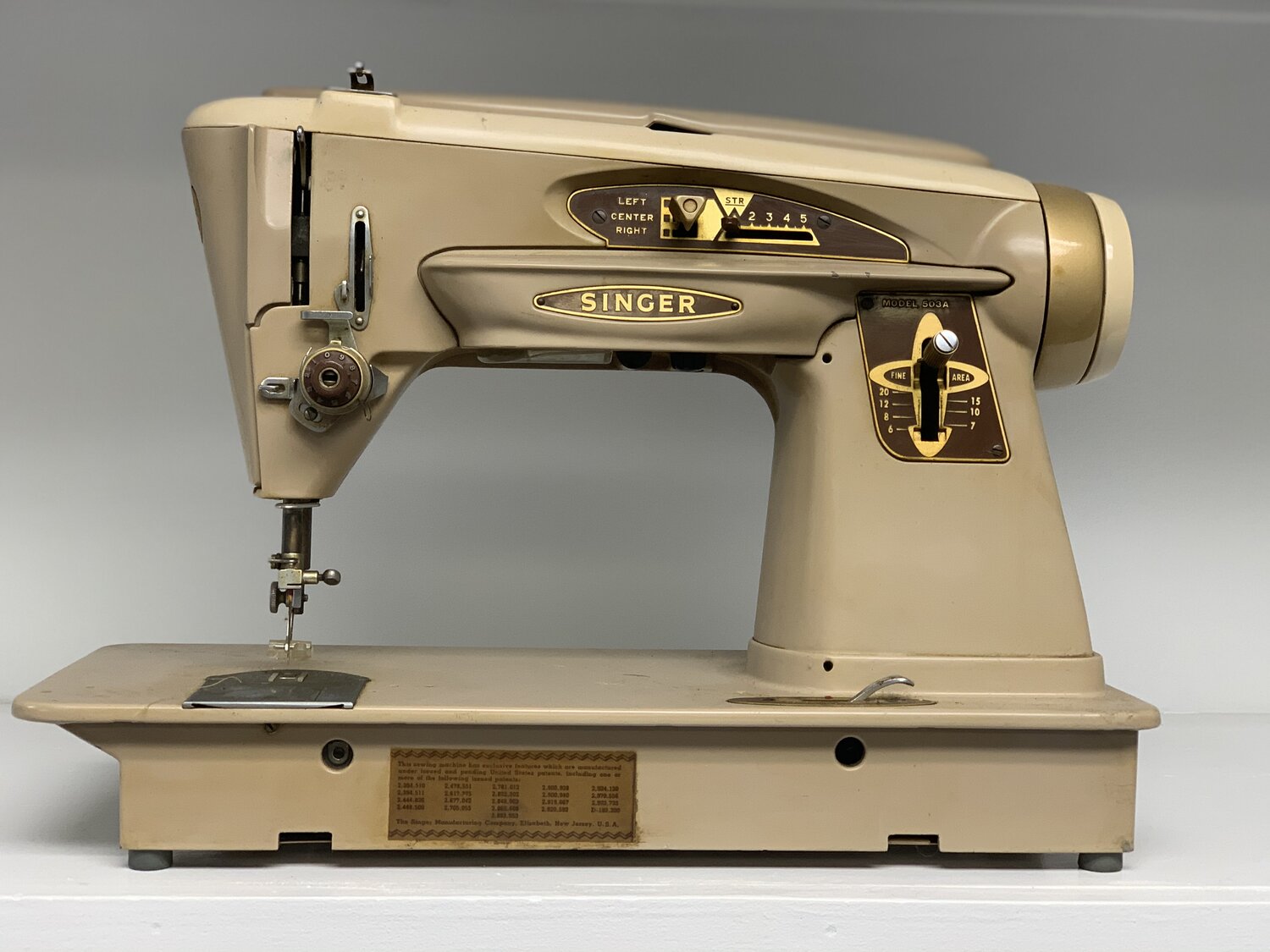 Old beige Singer sewing machine