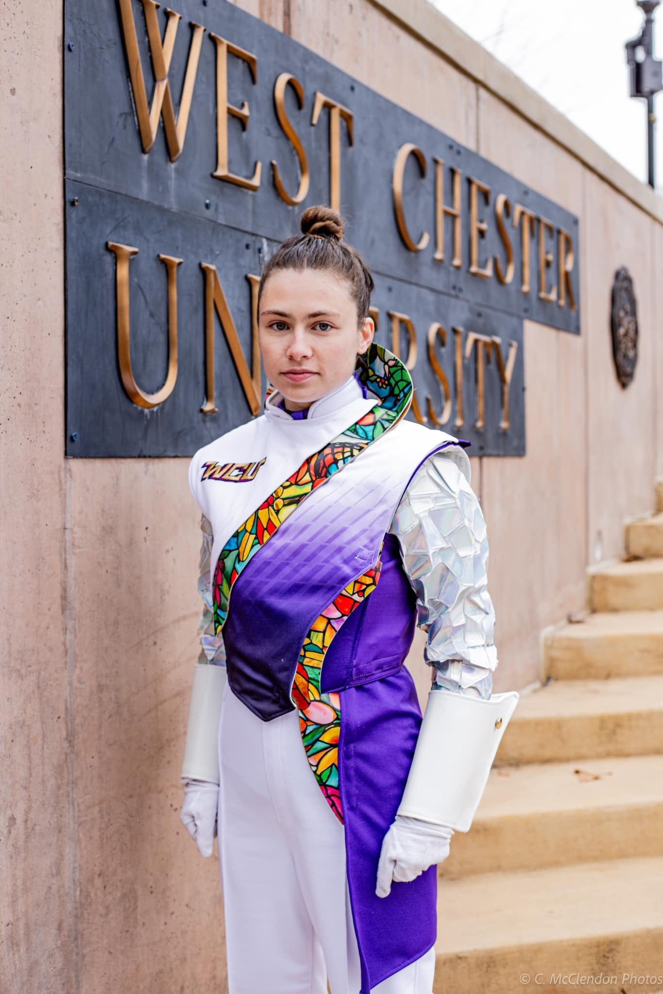 West Chester University woman custom band uniforms purple, black, and white